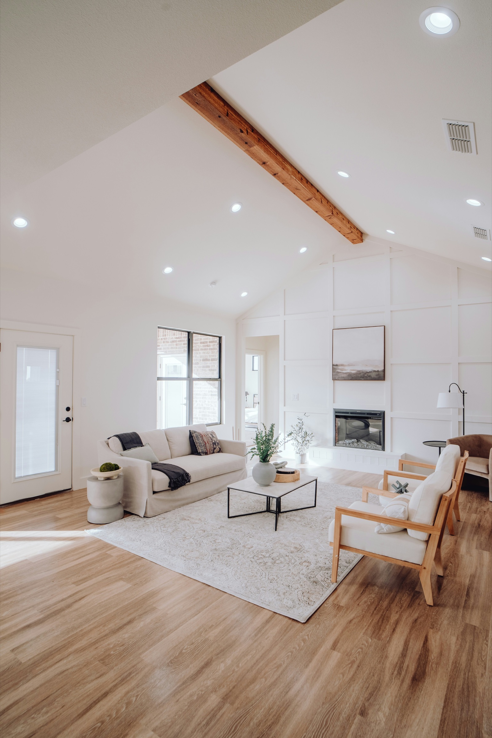 Renovated living room with vaulted ceiling and cedar beam in Fort Mill, South Carolina